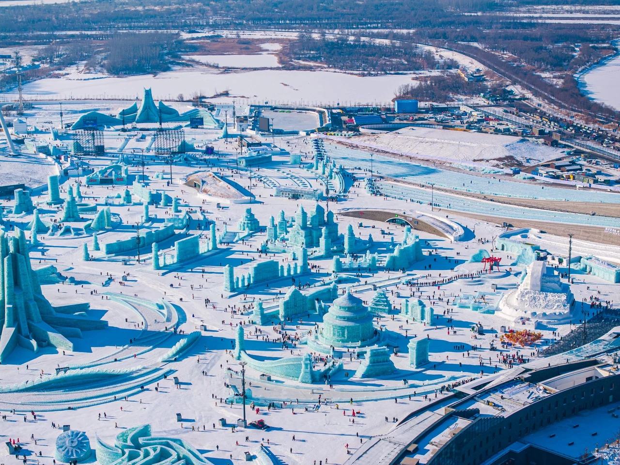 Winter ice-sculpture architecture photographed during company travel. Seasonal exhibits and opening depend on the confirmed programme; this image does not promise the current park layout.