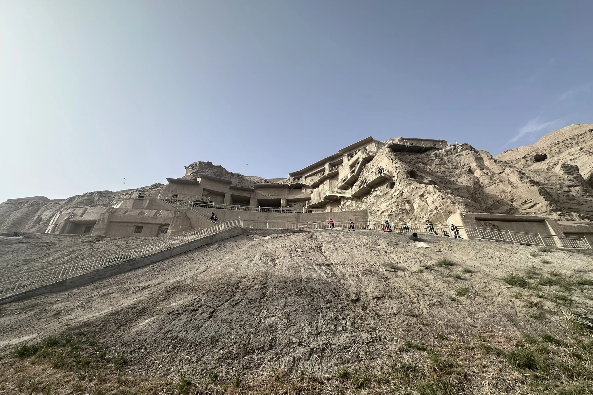 Kizil Thousand Buddha Caves, Xinjiang — cave-temple exterior, October 2026.